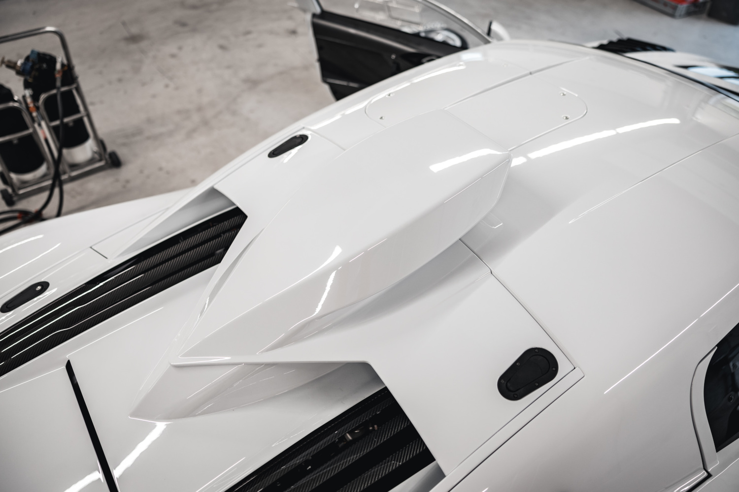 Close-up of air intake on roof of black and white XGT