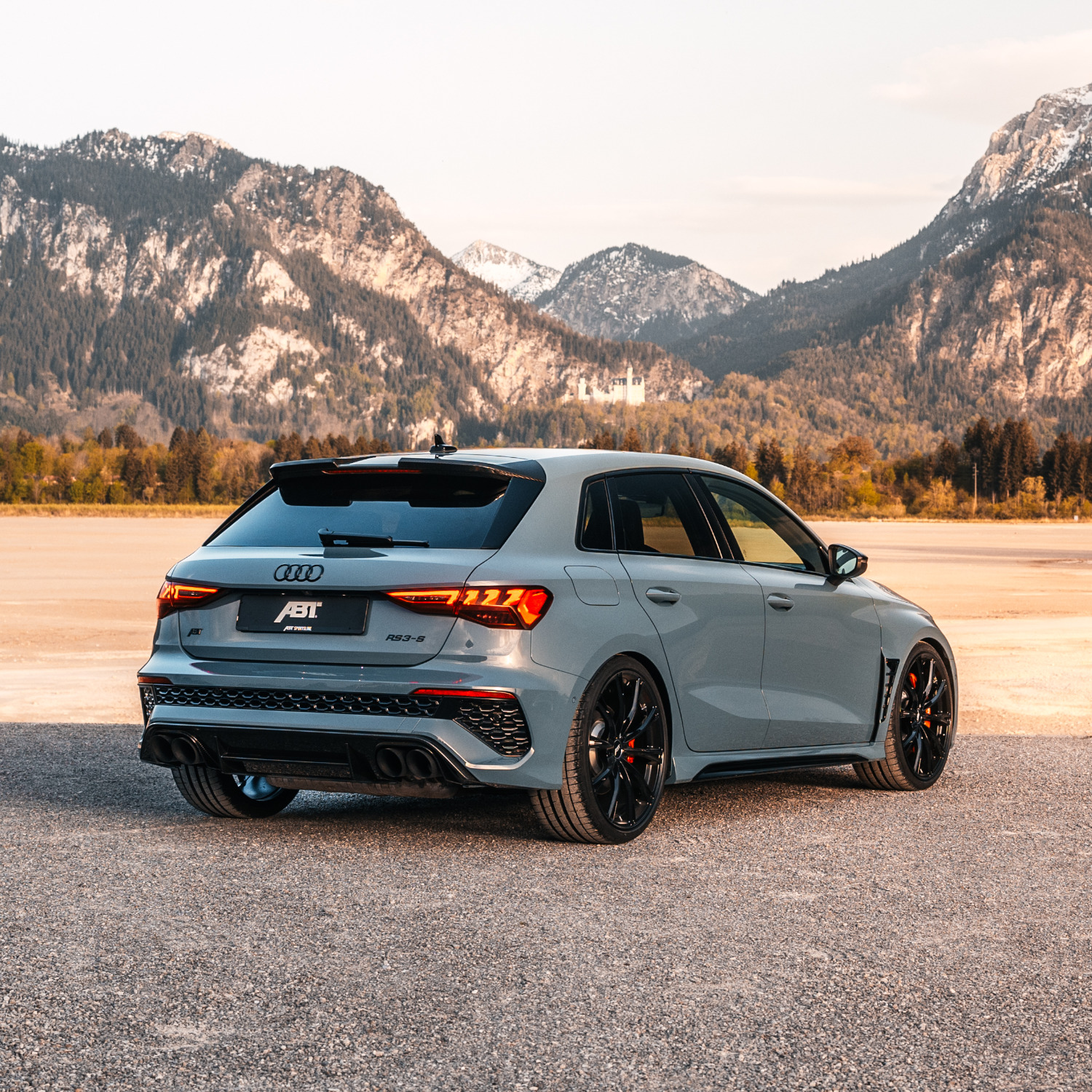 Blue RS3-S from the side rear view in front of a mountain panorama