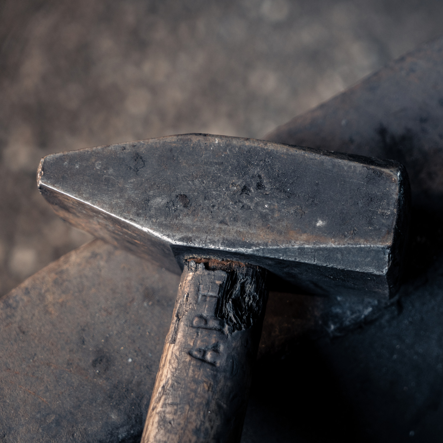 a blacksmith's hammer on an anvil