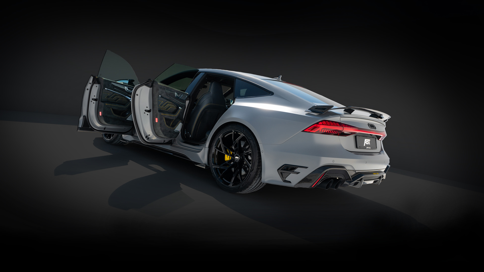 grey RS7-LE from the side rear view in black space 