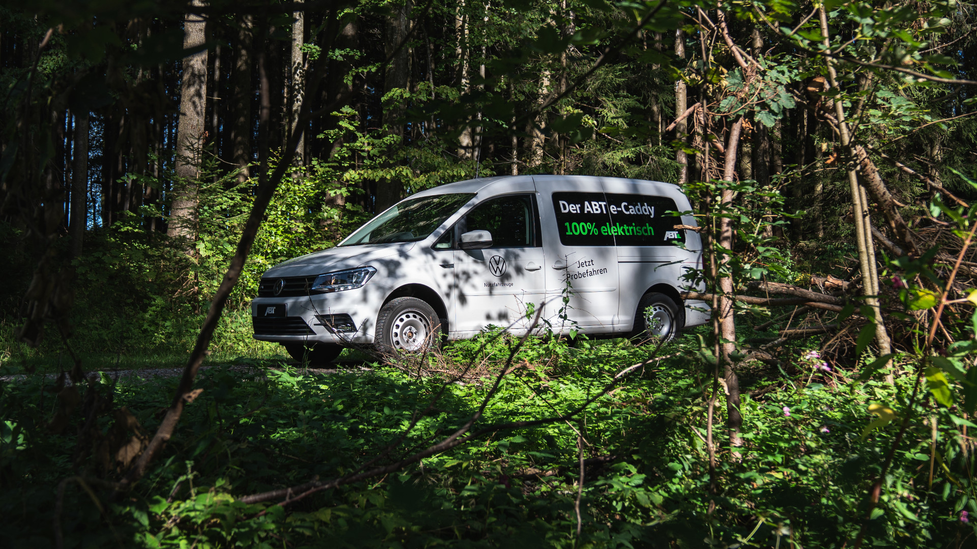 Side view of an ABT E-Caddy in the forest